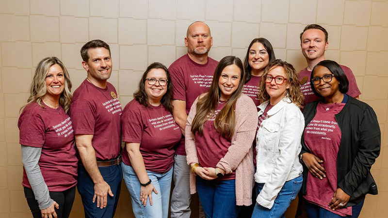 group of Traditions employees, smiling